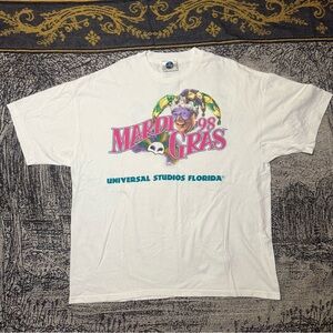 Universal White Mardi Gras '98 Graphic Tee with Pink & Purple Print